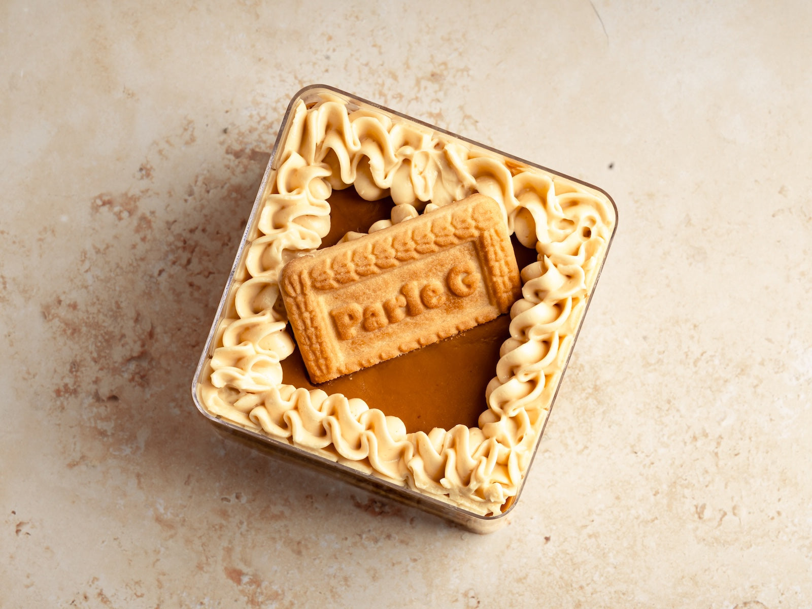 Chai Cake With Parle-g Biscuit Infused Custard And Lotus Biscoff Ganache